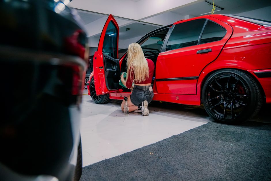Detailed cleaning of a car interior during a hand car wash
